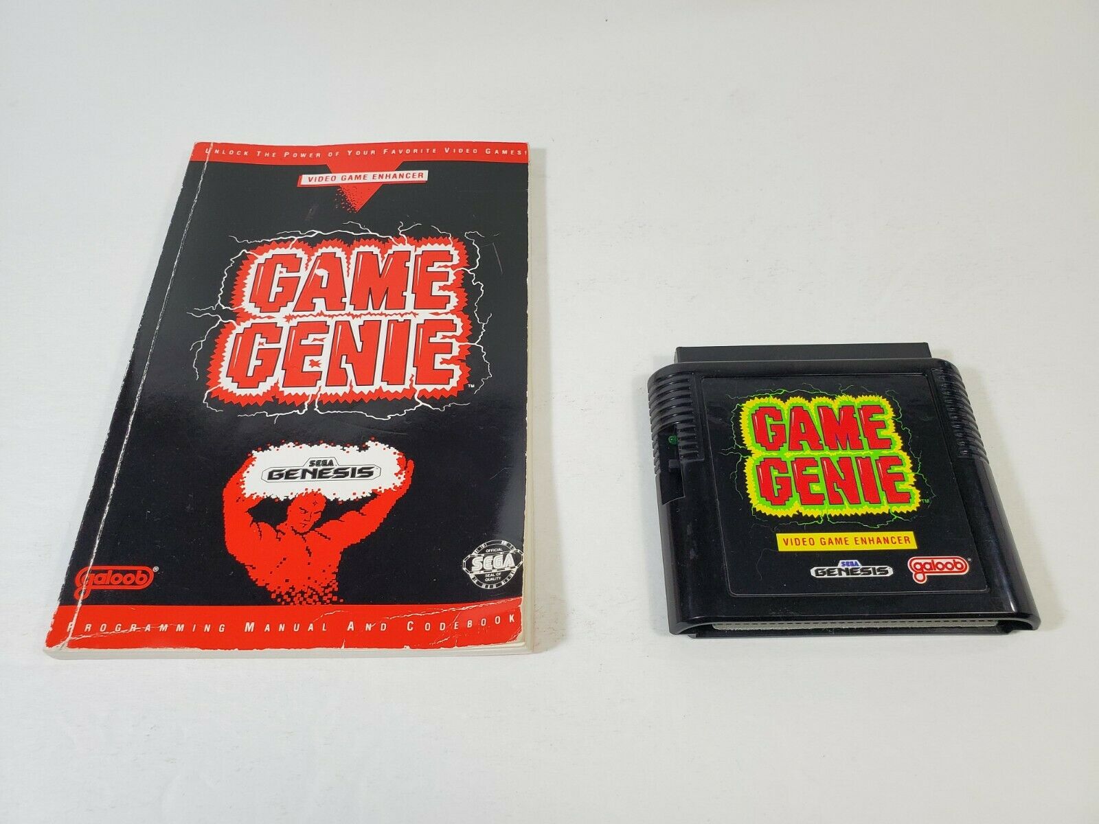 Game Genie With Code Book (Sega Genesis) – J2Games